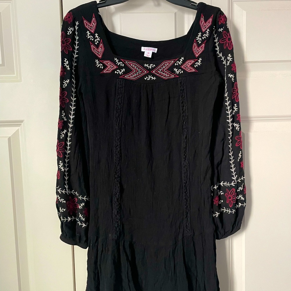 Black embroidered dress. With pink flowers.